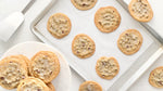 Chocolate Chip Cookies on a baking sheet and cookie plate