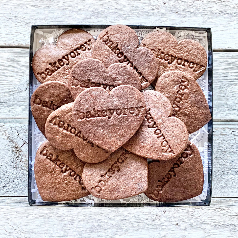 A box of one dozen Chocolate Heart Sugar Cookies