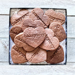 A box of one dozen Chocolate Heart Sugar Cookies