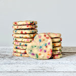 A stack of Mini Funfetti Heart Sugar Cookies